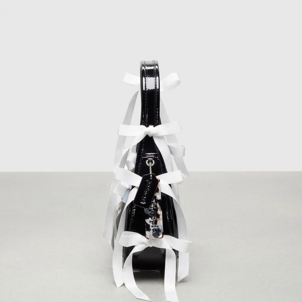 Ergo Bag In Crinkle Patent Coachtopia Leather With Allover Bows